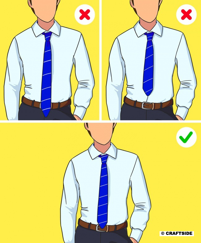 The tip of your tie should reach your waist and cross it just a little.