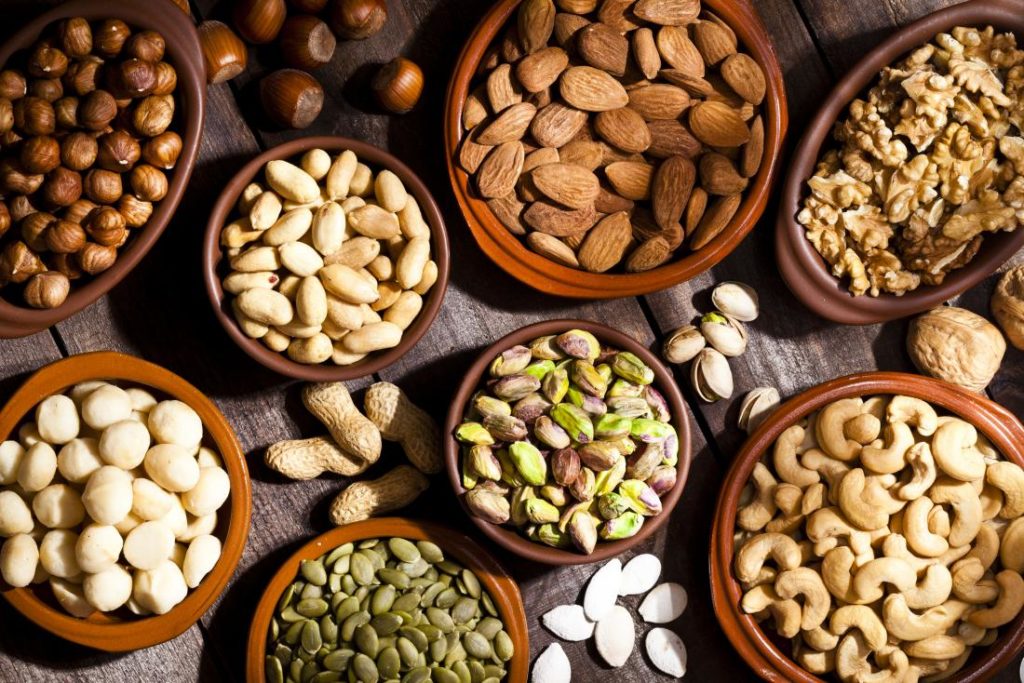 Potassium-high foods, such as almonds and pistachio nuts, can help varicose veins by reducing water retention in the body.